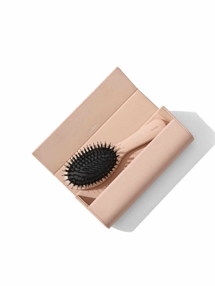 Nuori revitalising hair brush small rose luxury pouch